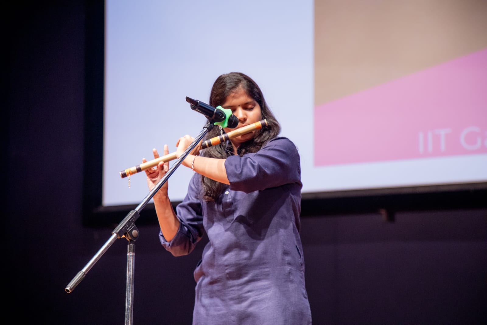 Priyanshi performing spoken word on stage