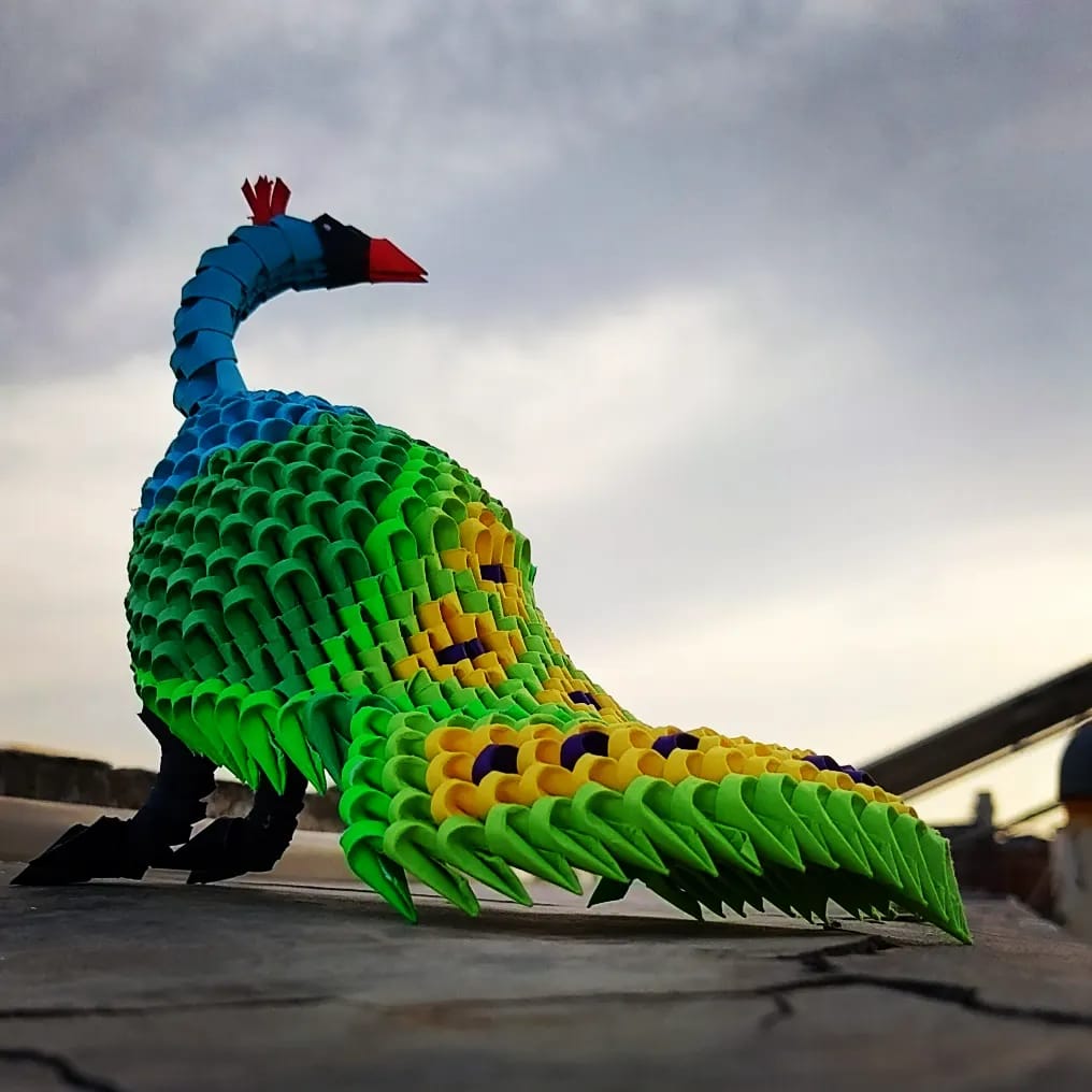 A handmade 3D origami peacock